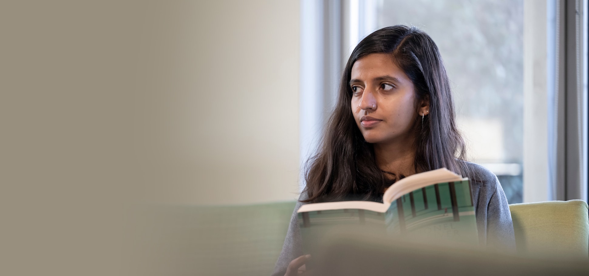 Client-reading-book-on-seat